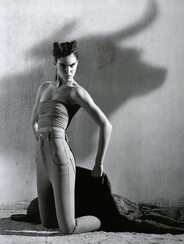 model in high-waisted pants