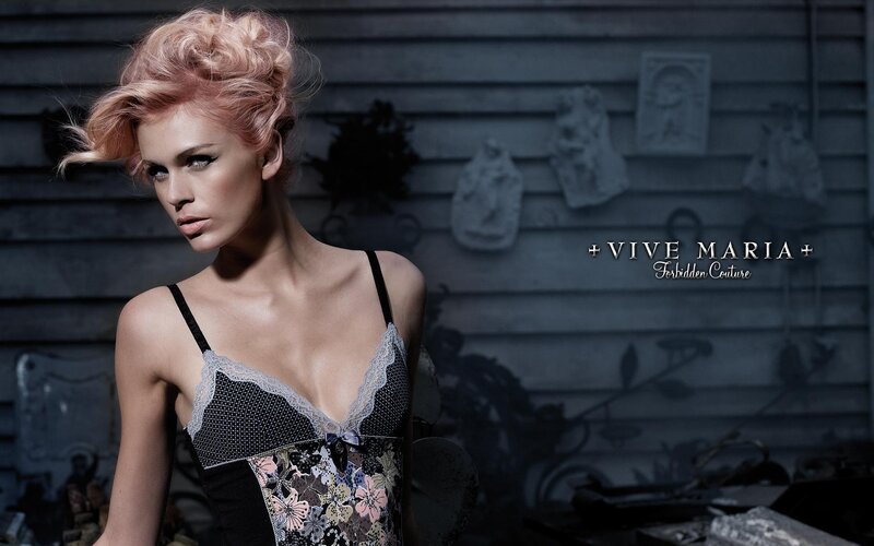 model in lingerie against rustic wall