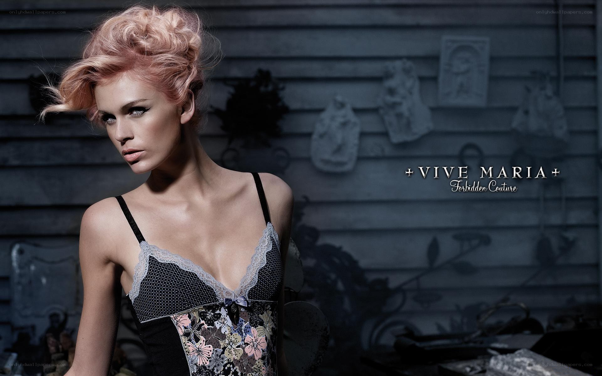 model in lingerie against rustic wall