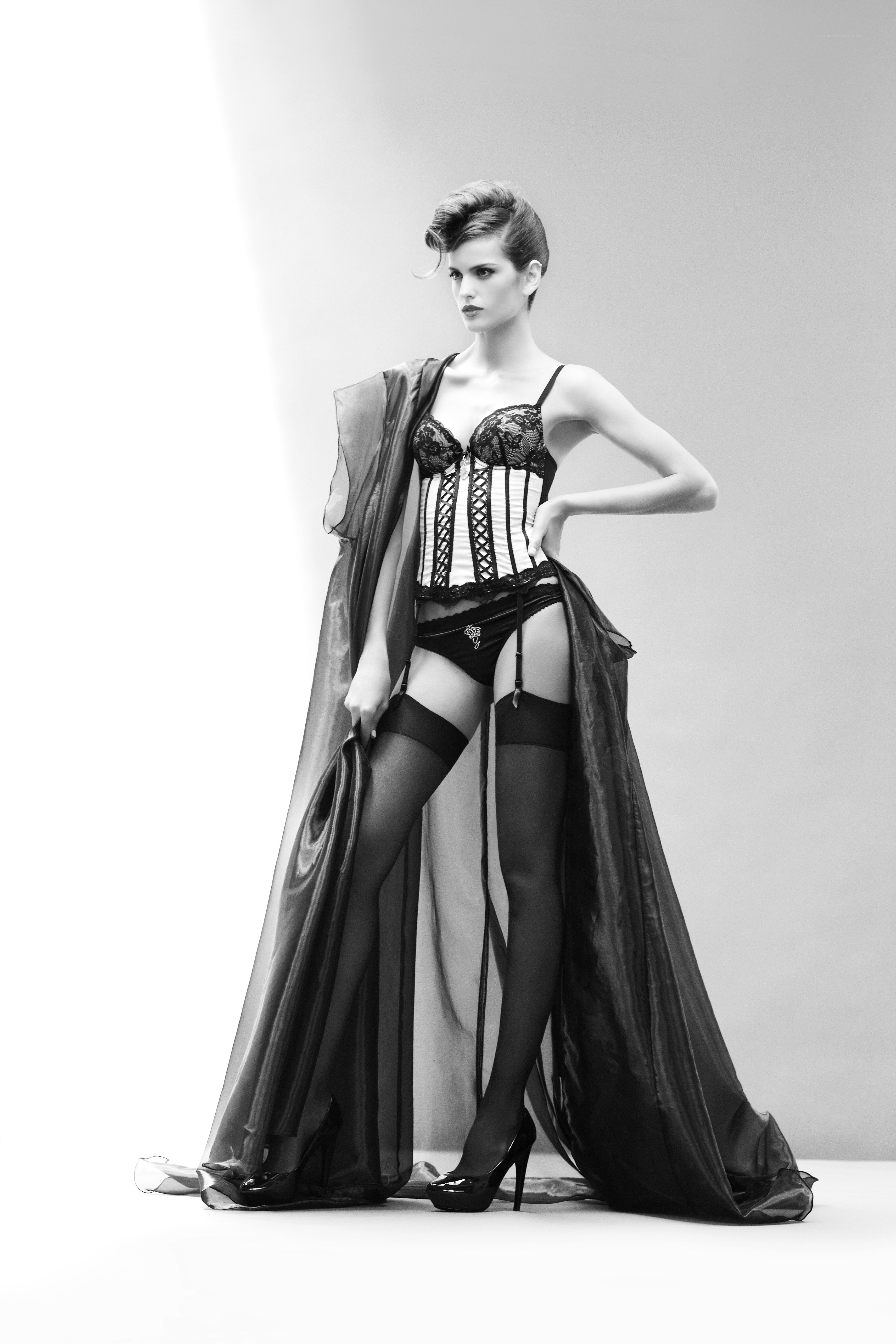 model in lingerie and cape