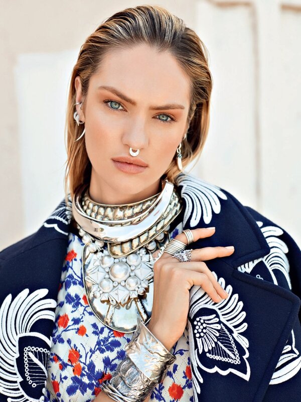 model in ornate jewelry and coat