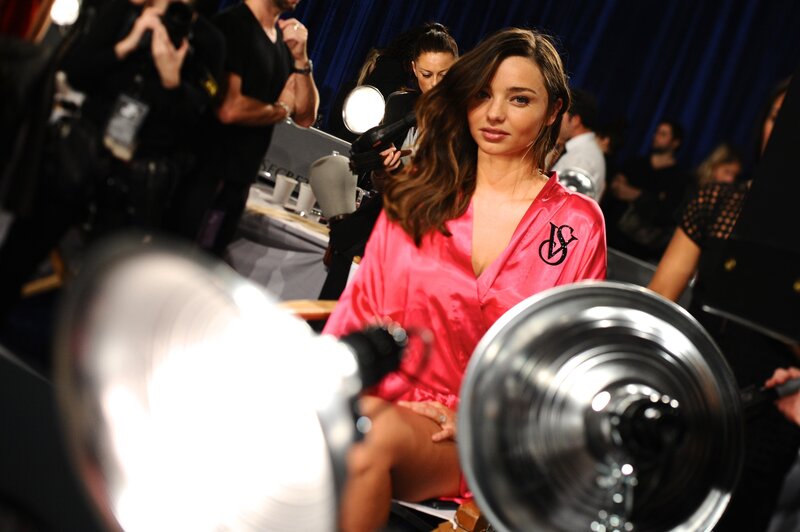Model in pink robe backstage