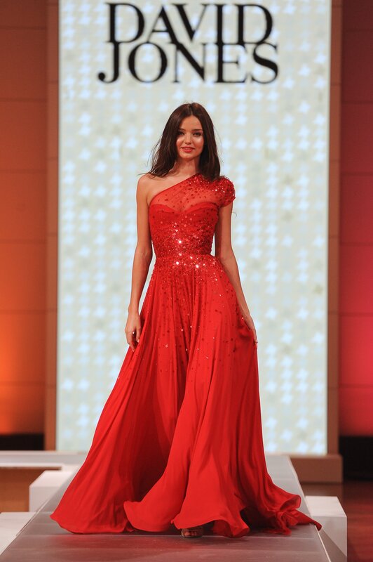 Model in red gown on runway