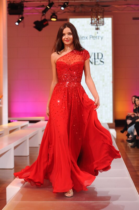 Model in red gown on runway