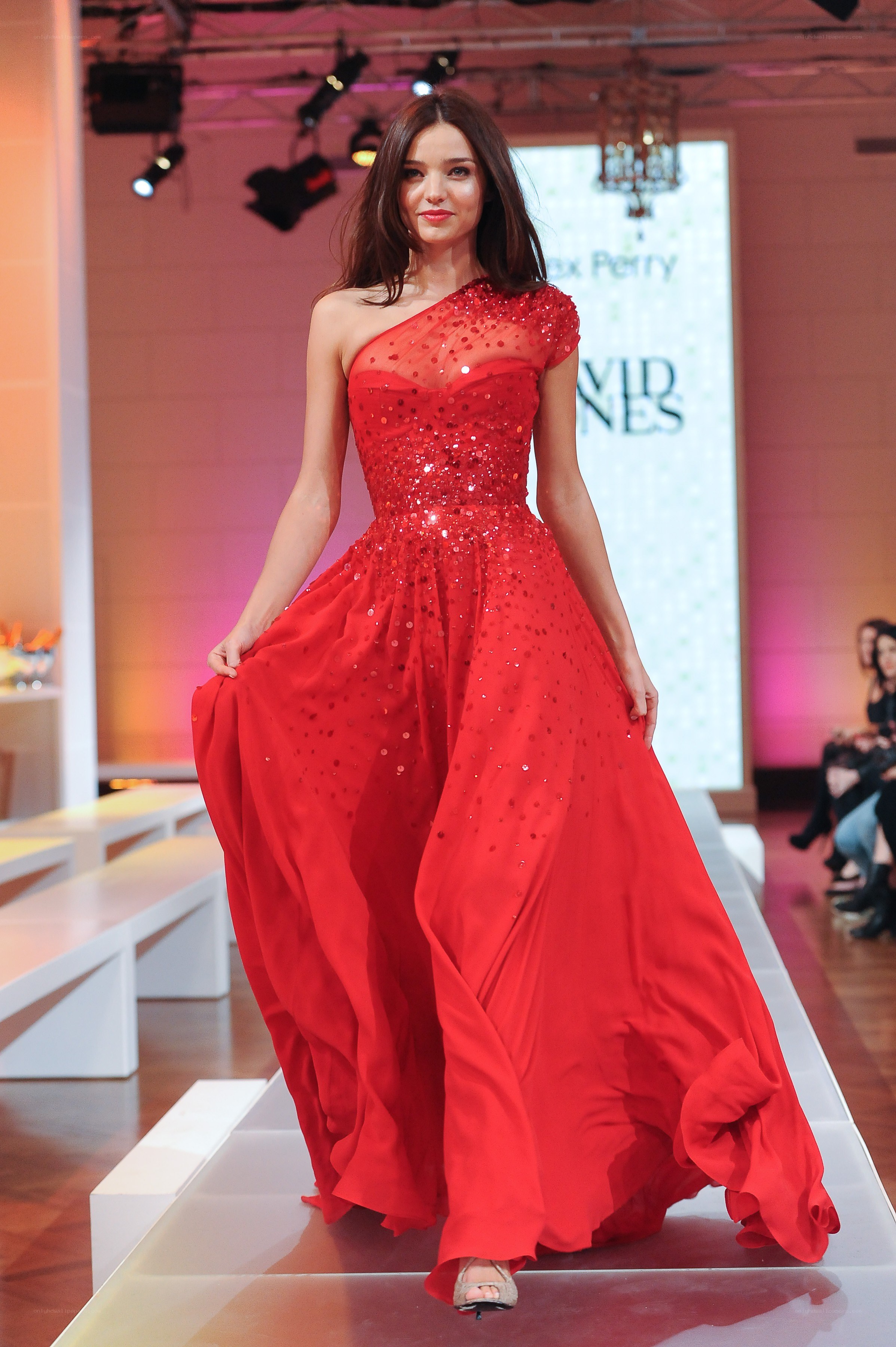Model in red sequin gown