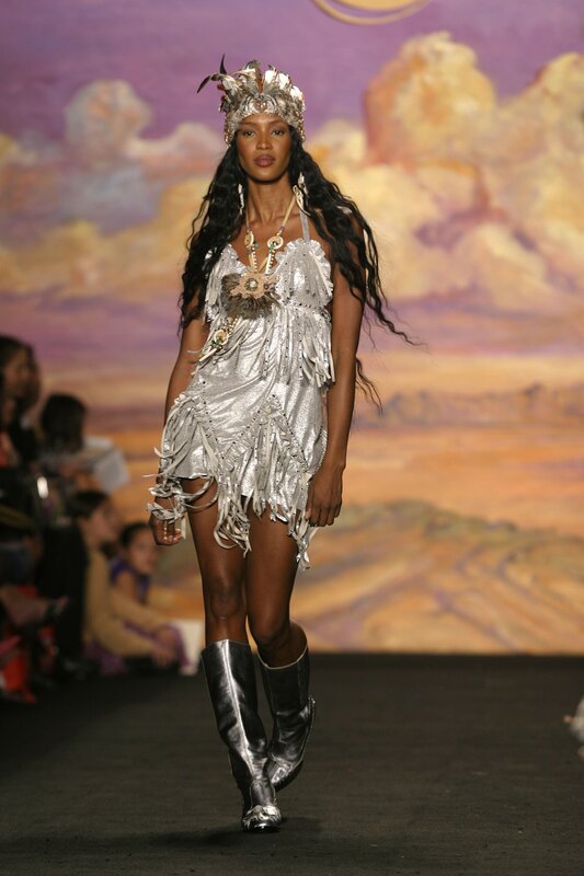 Model in silver fringe outfit