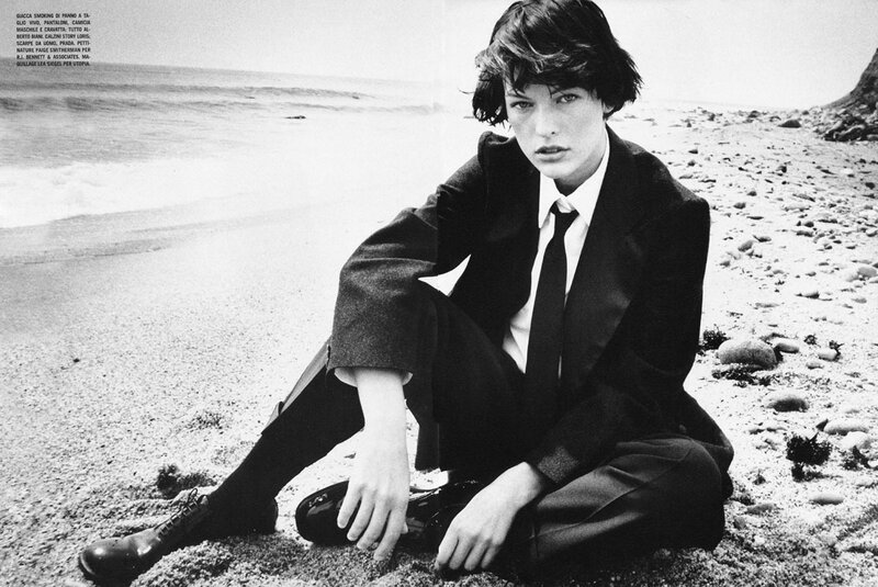 model in suit on beach