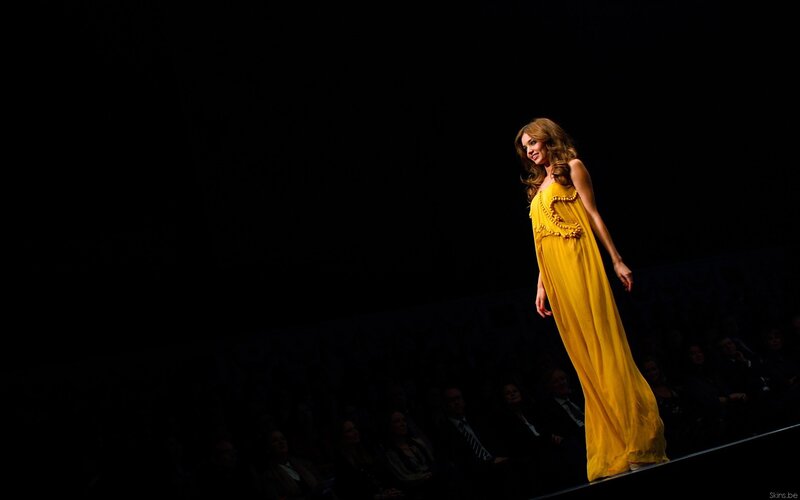 Model in yellow dress on runway