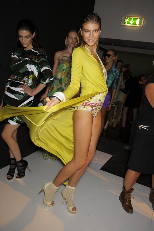 Model in yellow dress on runway