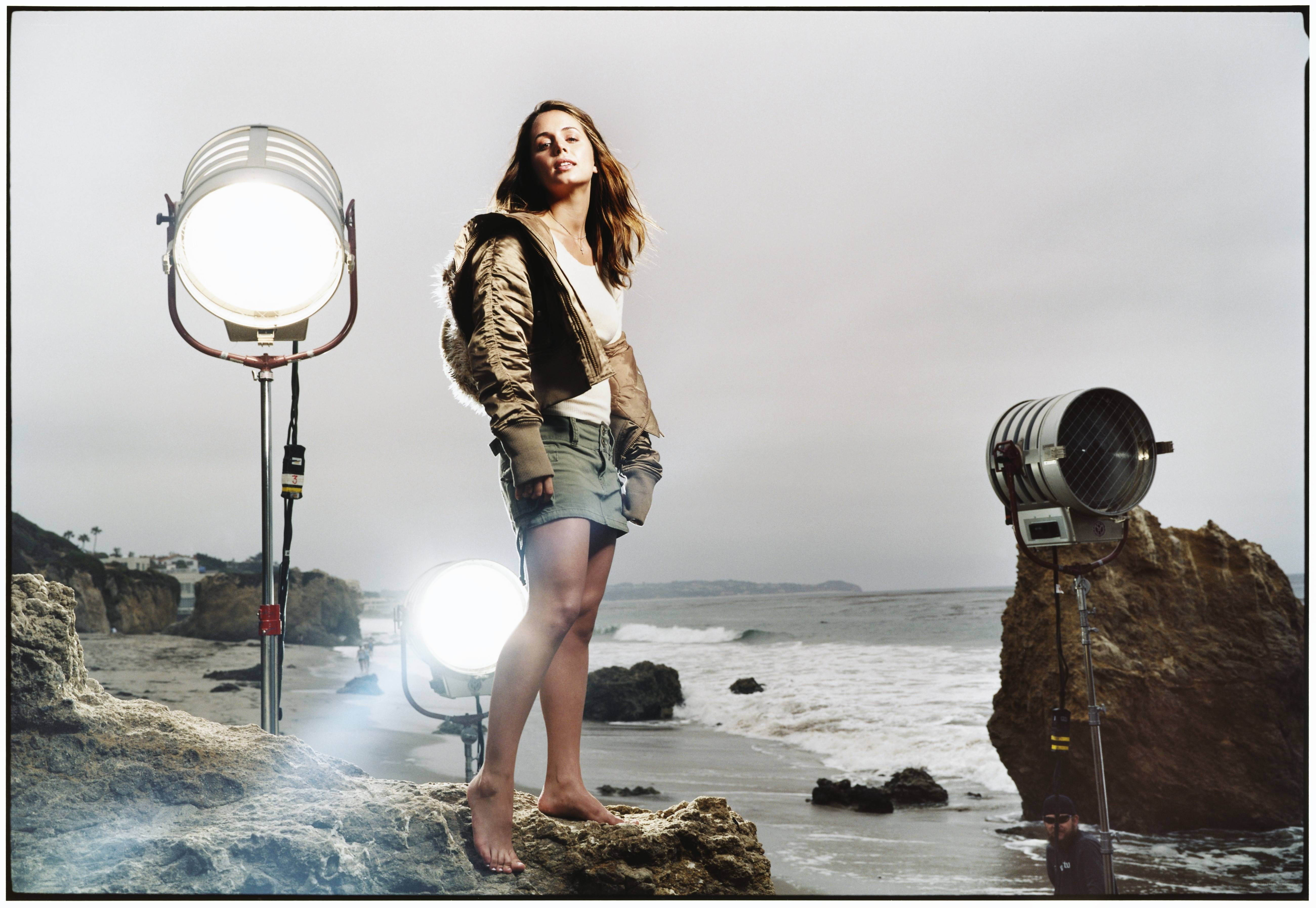 model on beach with studio lights