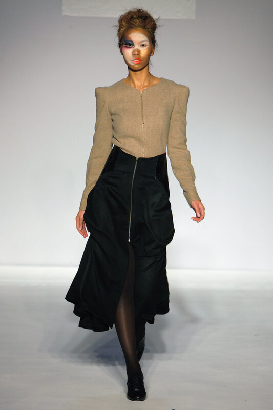 Model on runway in avant-garde outfit