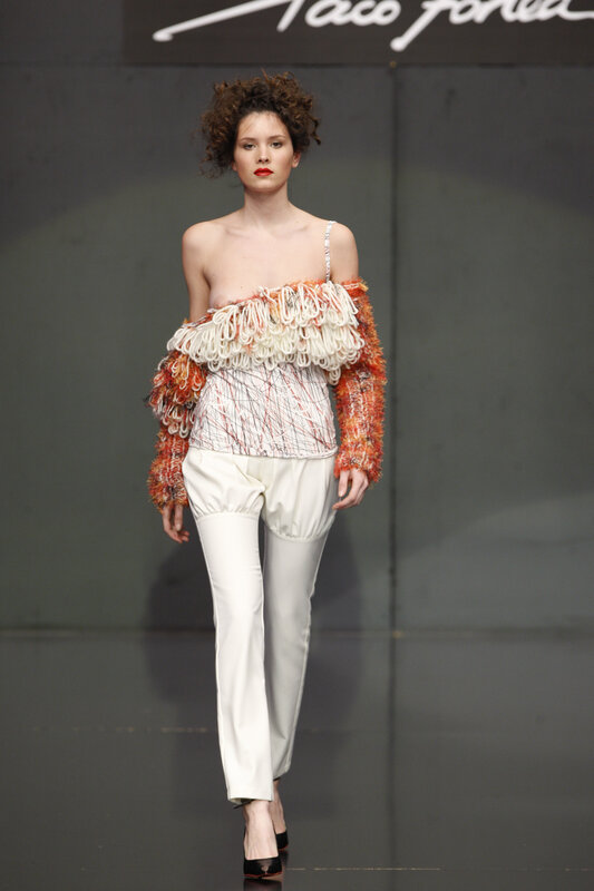 Model on runway in avant-garde outfit