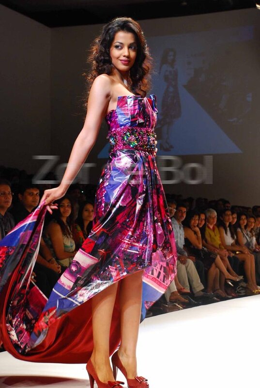 Model on runway in colorful dress