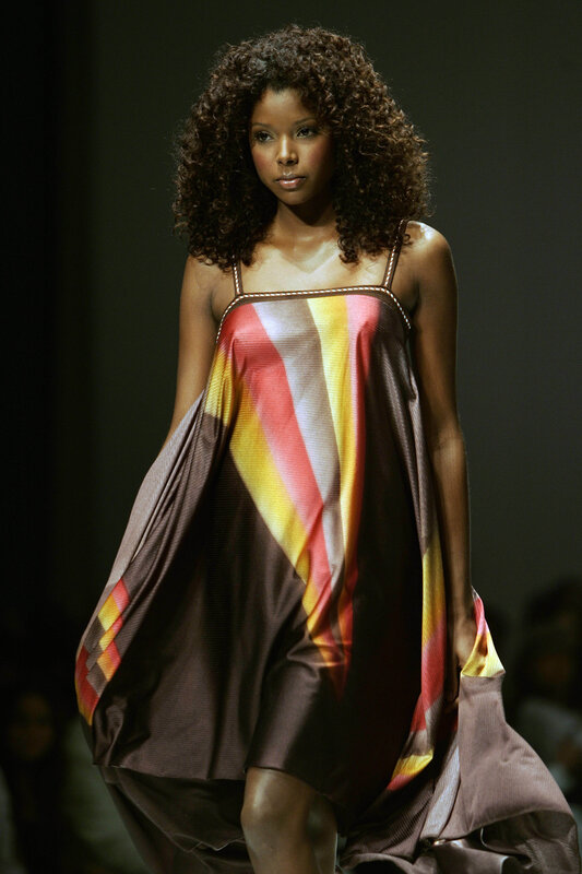 model on runway in colorful dress