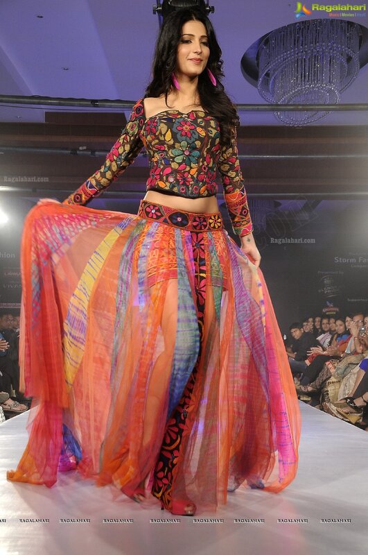 Model on runway in colorful outfit
