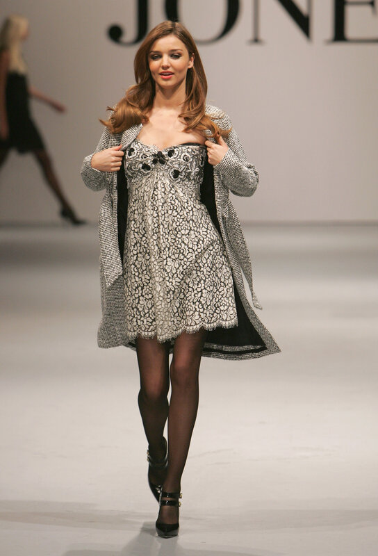 Model on runway in dress