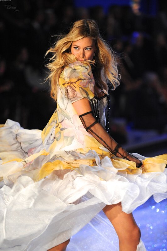 Model on runway in floral dress