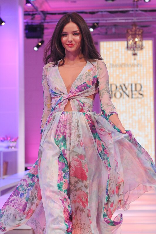 Model on runway in floral dress