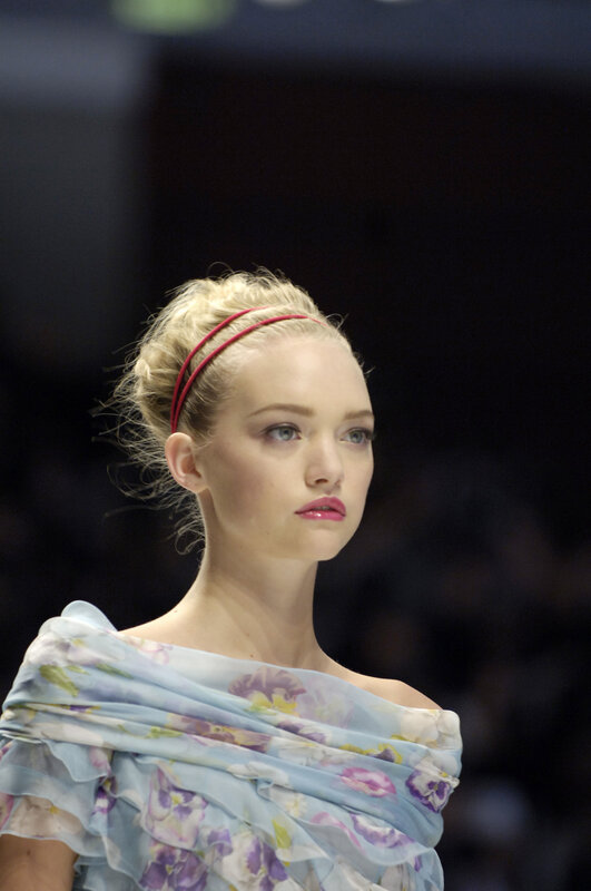 model on runway in floral dress