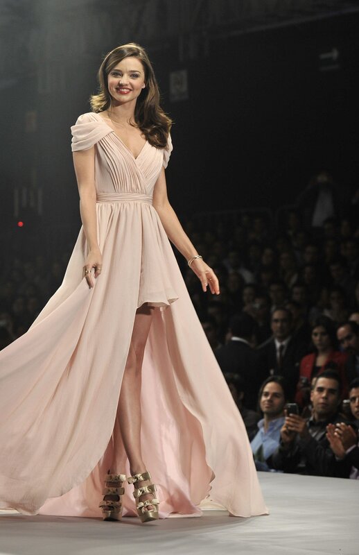 Model on runway in pink gown
