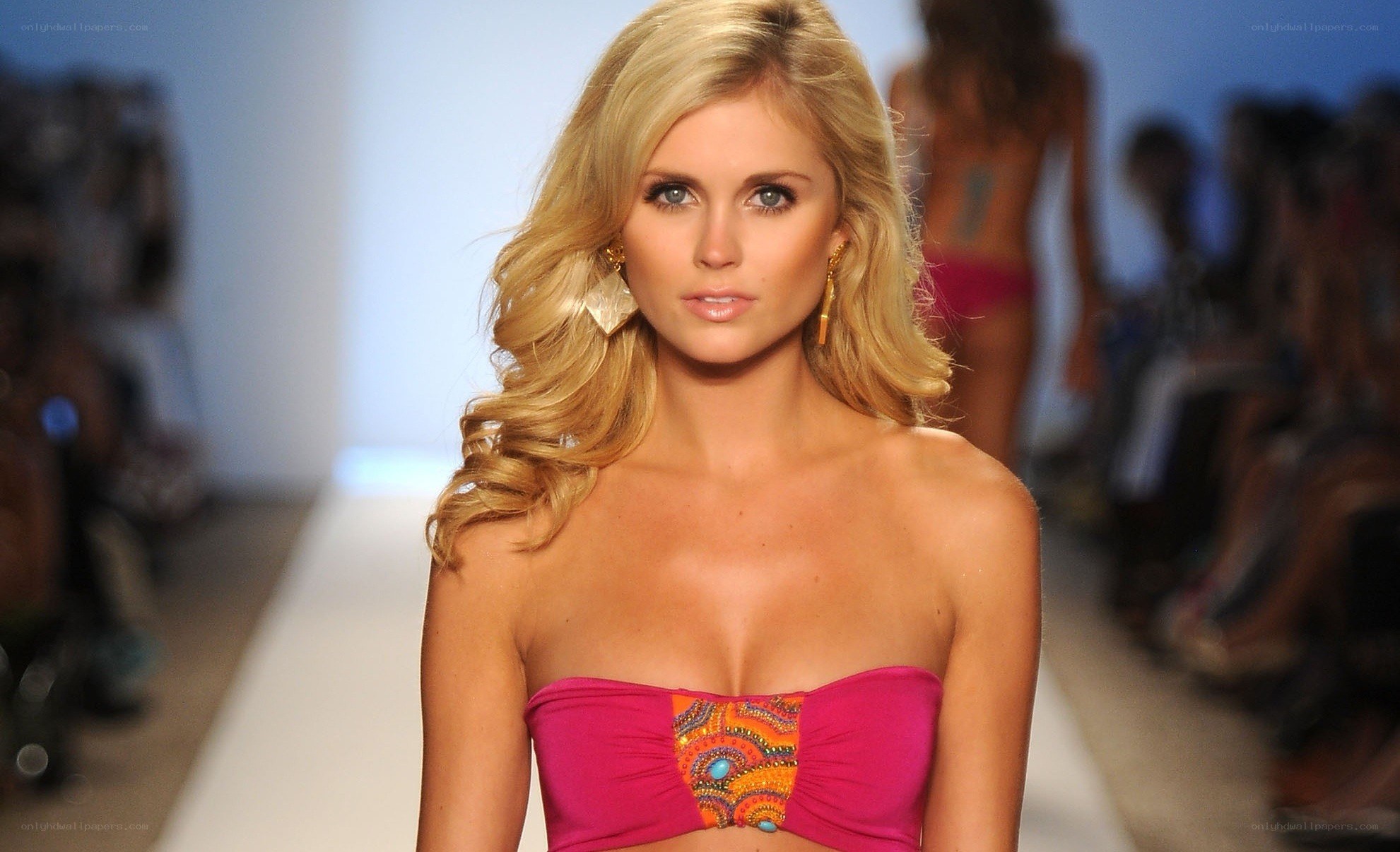 Model on runway in pink top