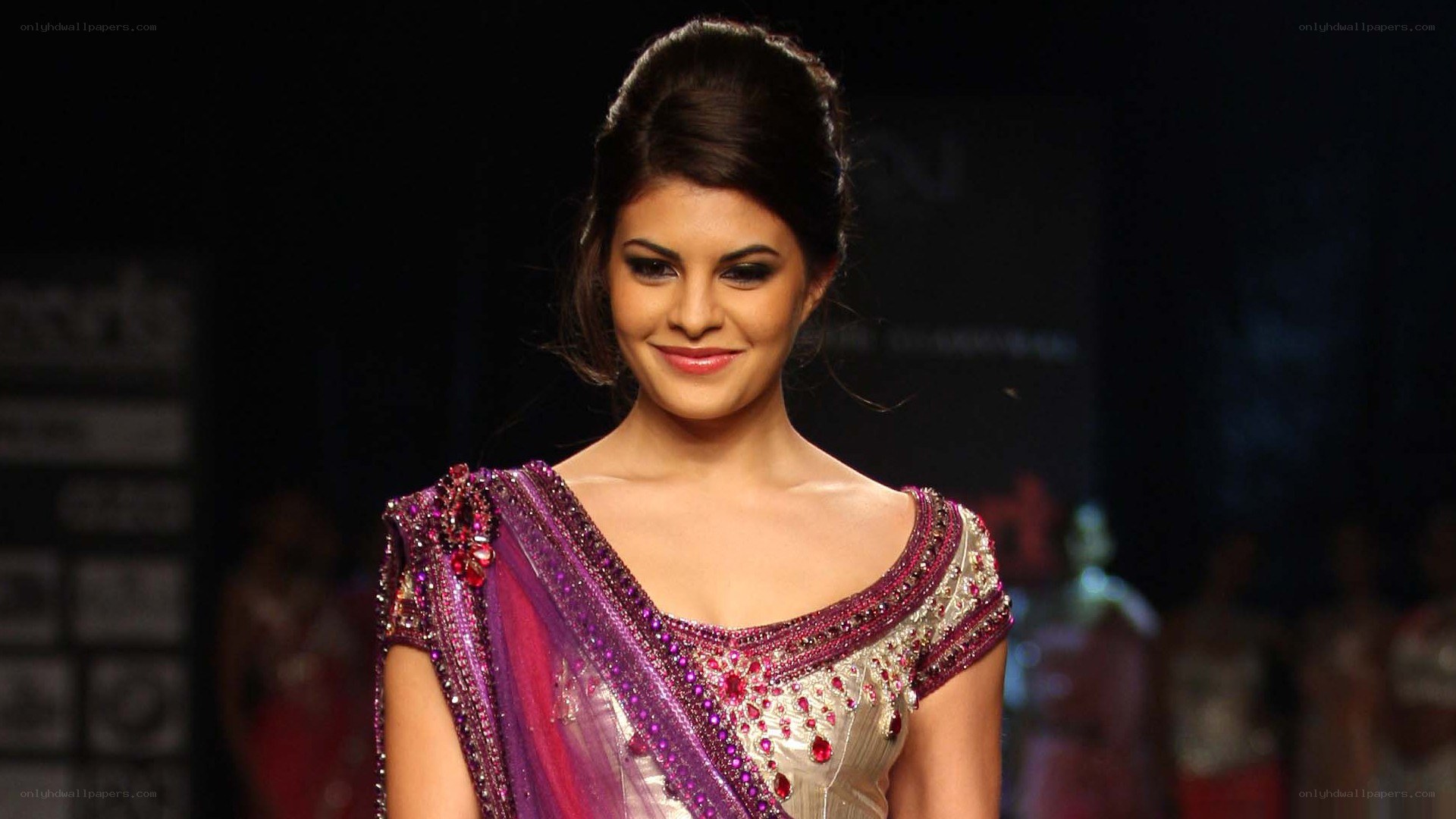 model on runway in sari