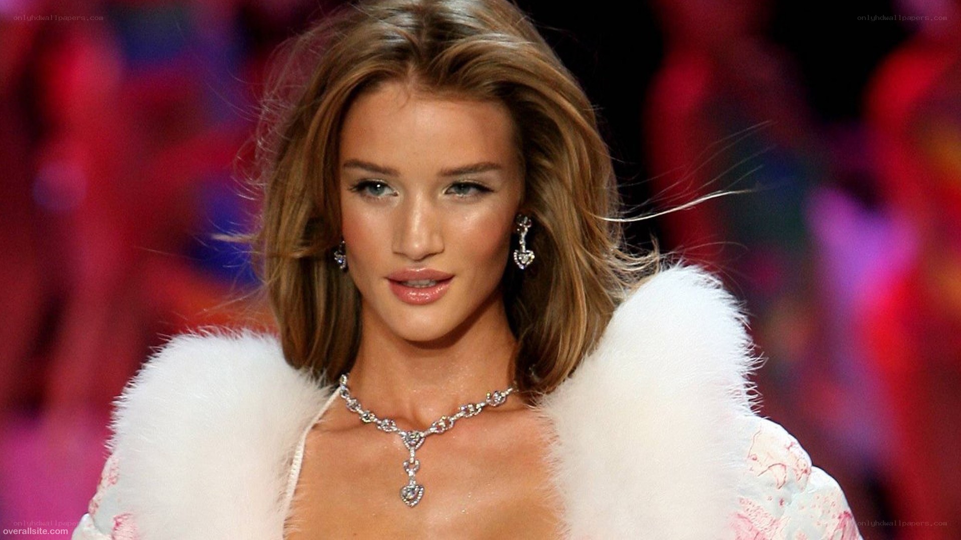 model on runway in white coat