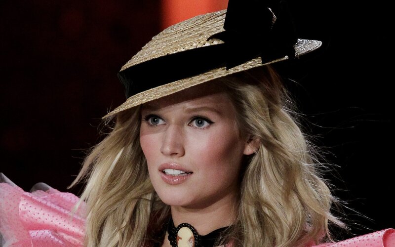 model on runway wearing hat