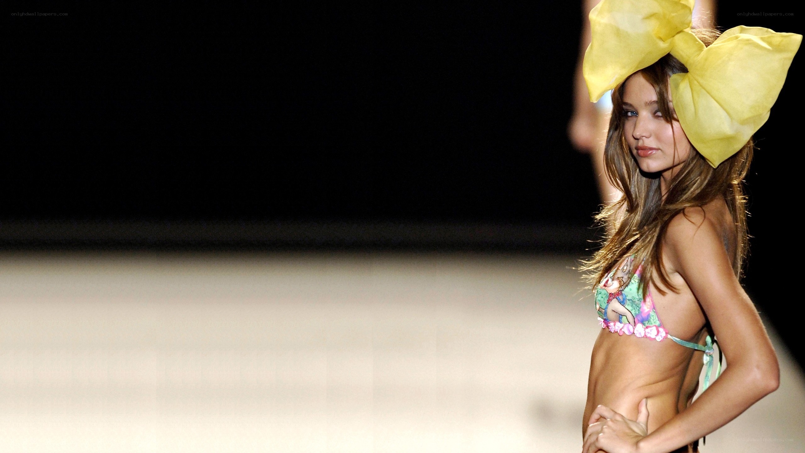 Model on runway with bow