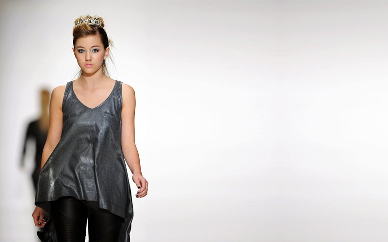 Model on runway with crown