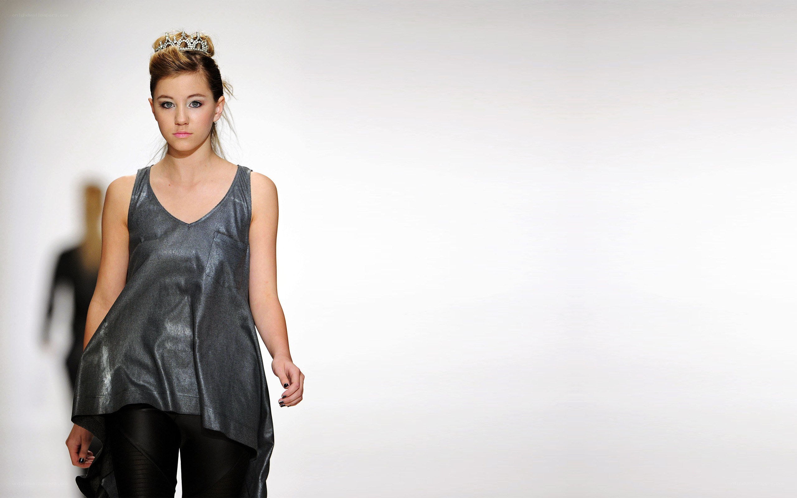 Model on runway with crown