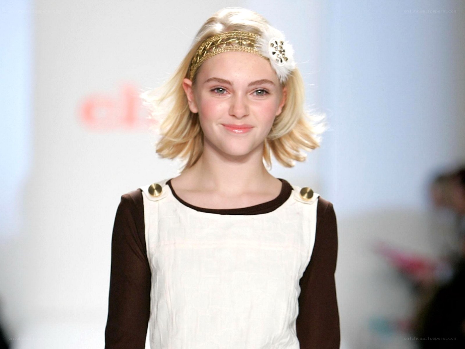 model on runway with headband