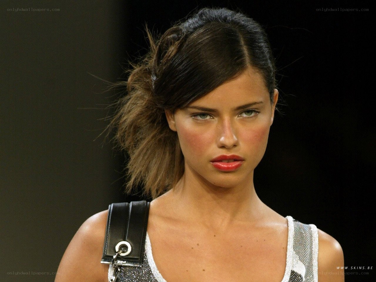 model on runway with red lipstick