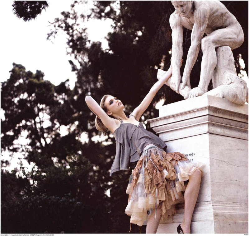 model posing with statue