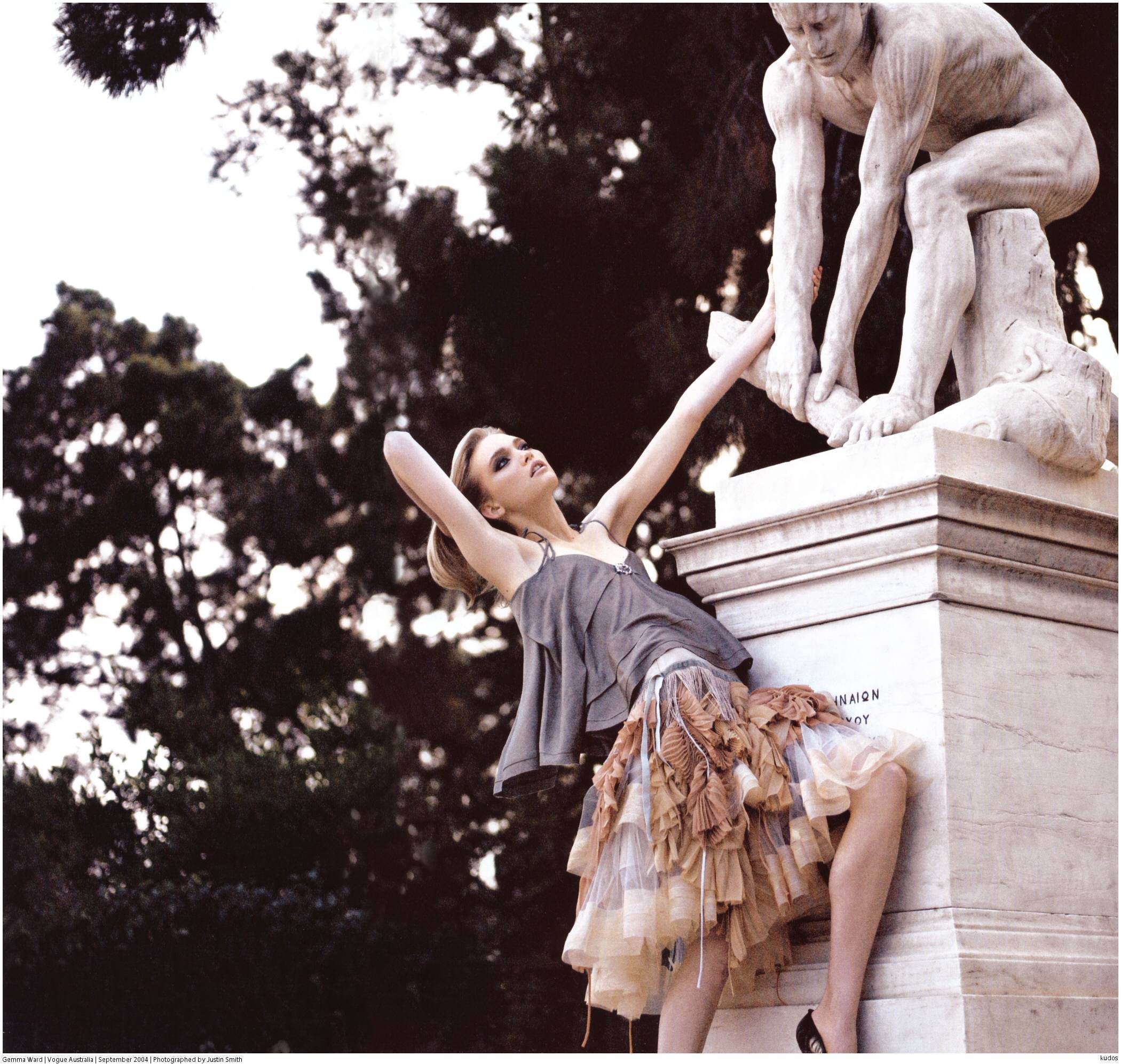 model posing with statue