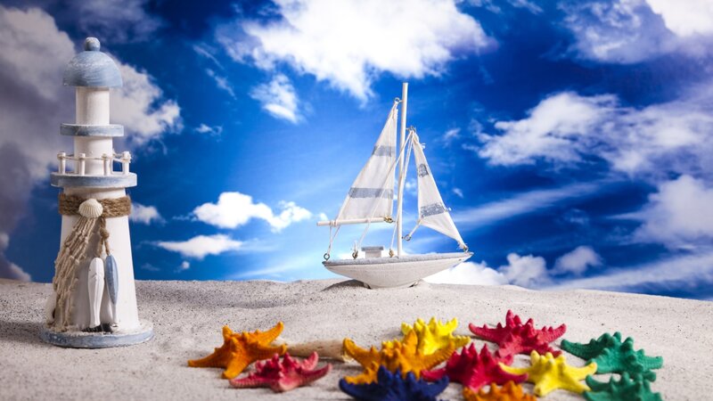 Model Sailboat and Lighthouse