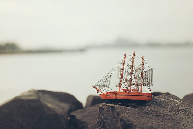 Model Sailboat on Rocks