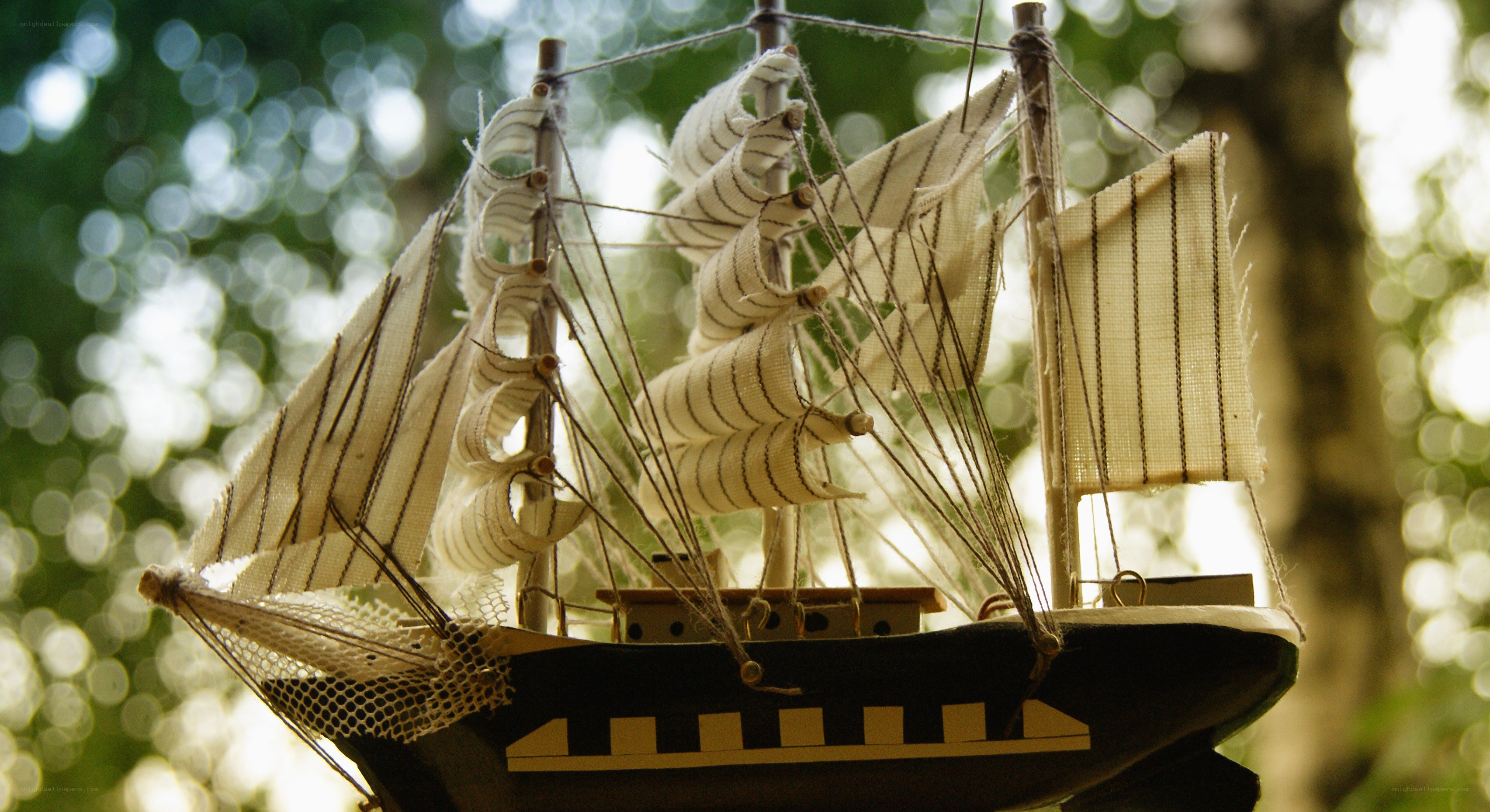 model ship in forest light