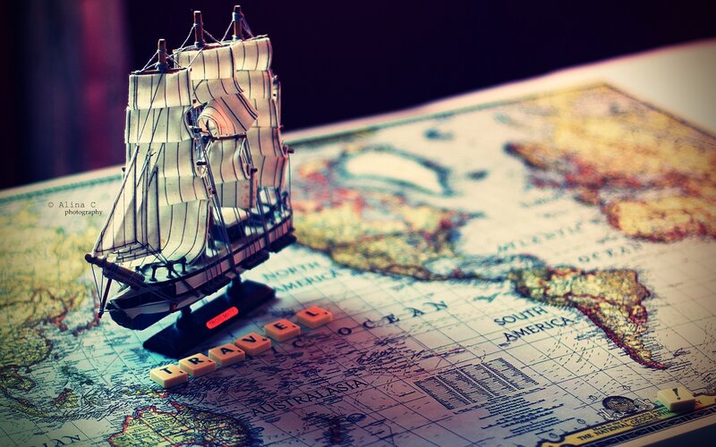 Model Ship on Map — Brown, Dramatic, Photograph