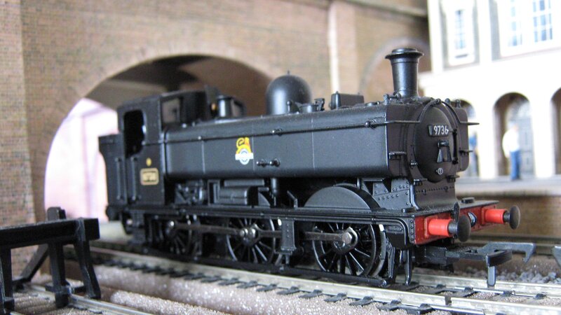 Model steam locomotive on track