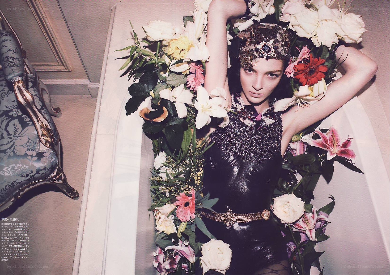model surrounded by flowers