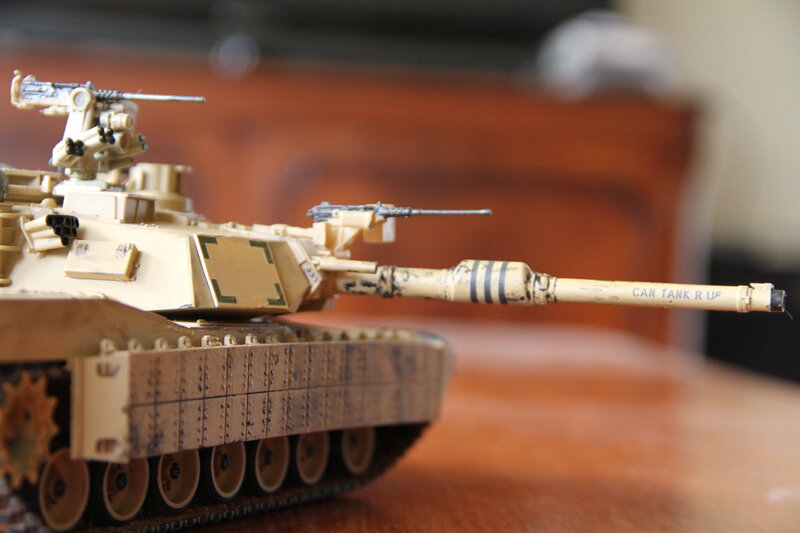 model tank on wooden surface