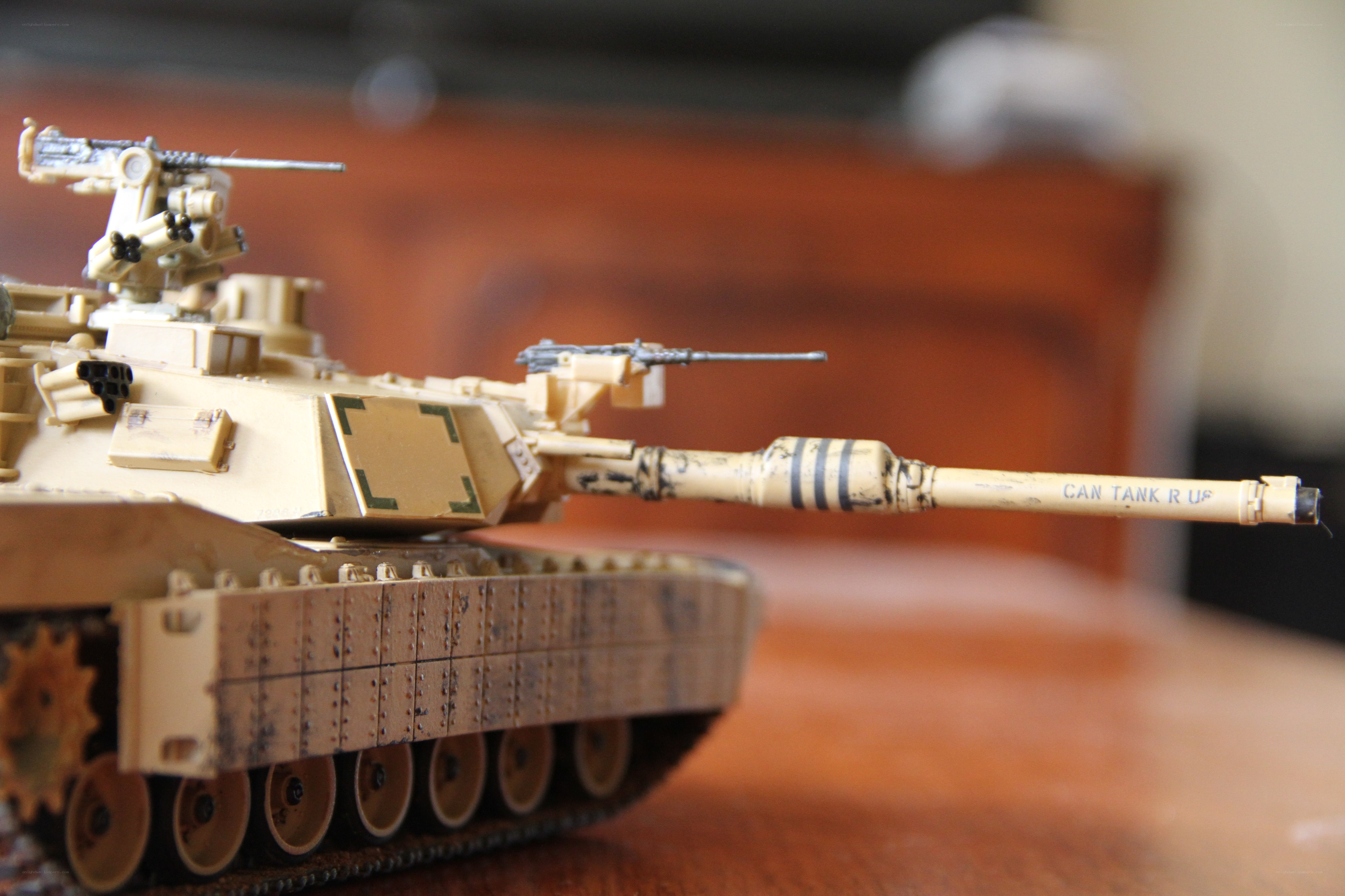 model tank on wooden surface