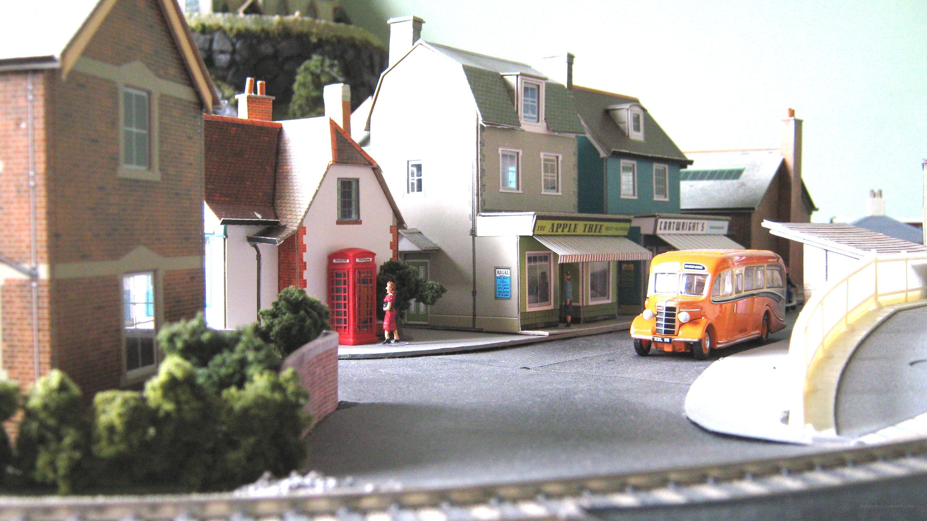 model town with bus and phone booth
