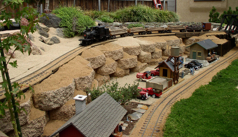 model train layout with logging scene