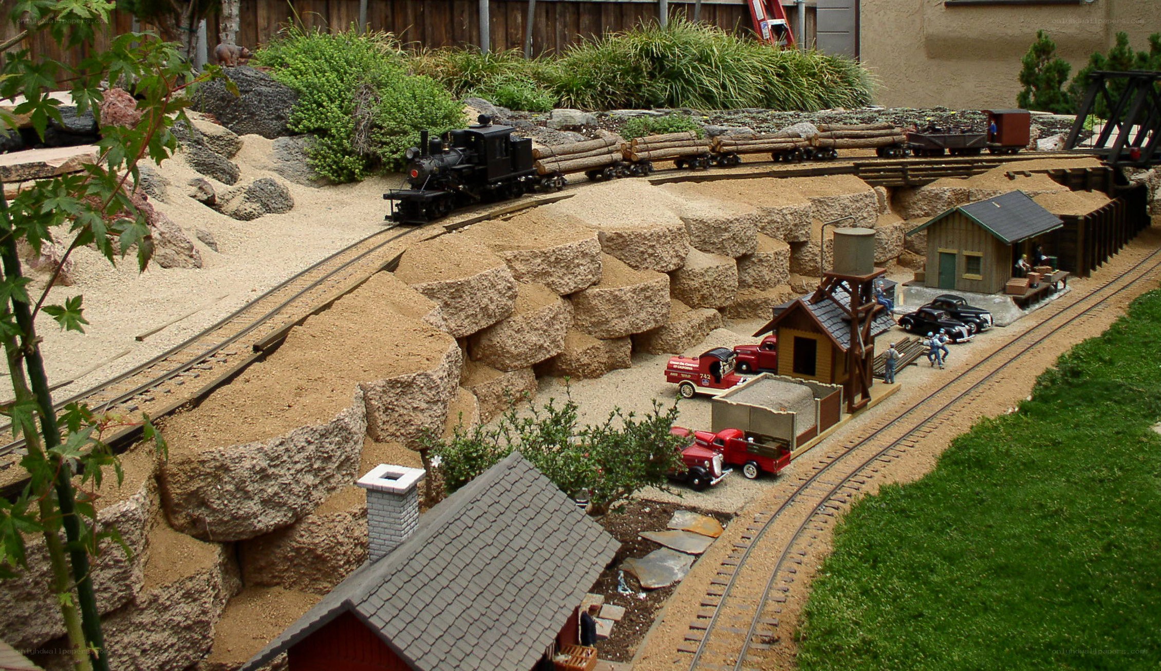 model train layout with logging scene