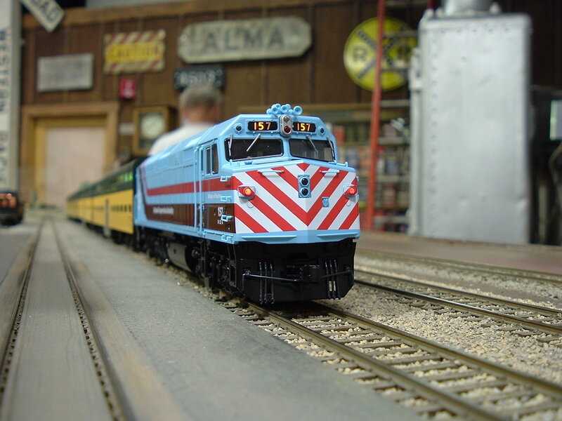 Model Train on Tracks — Blue
