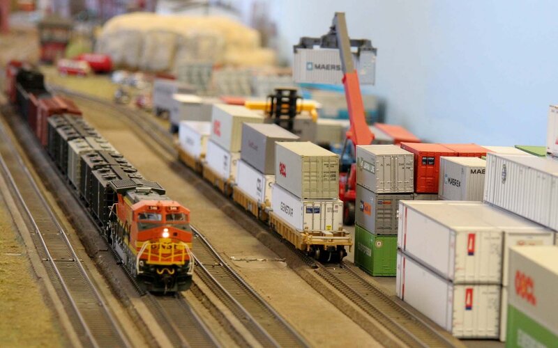 Model Train on Tracks — Orange