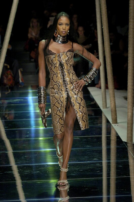 Model walks runway in snakeskin dress