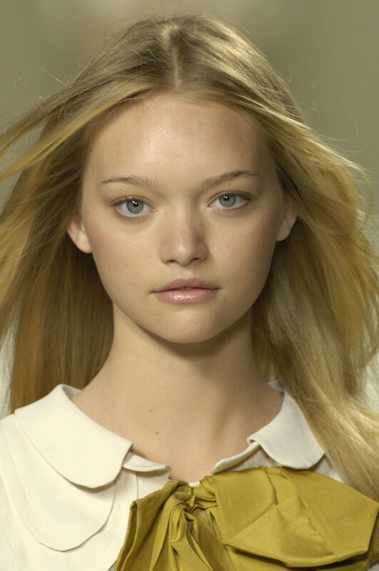 model with blonde hair and green eyes